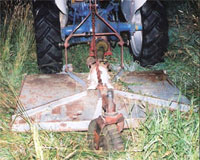 Photo of tractor with rotary cutter