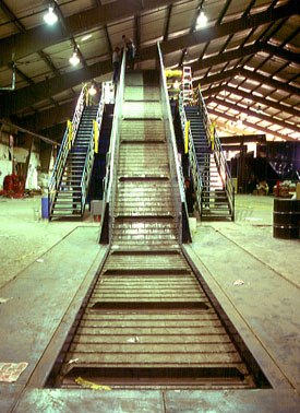 photo of metal conveyor belt inside recycling plant