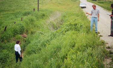 photo of FACE investigators in ditch where accident occured