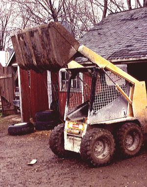 Photo of skid-steer loader with raised bucket