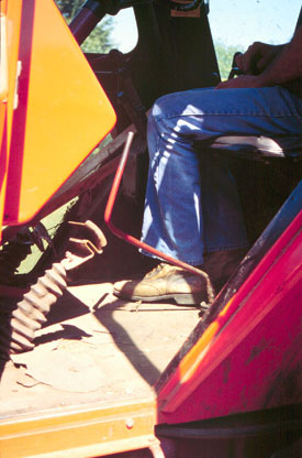 photo of the tractor's gear shift and clutch pedal