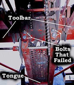 Photo 4: indicates toolbar, tongue, and bolts that failed