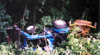 Photo of an accident scene involving a tractor overturn