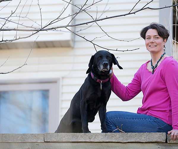 Christine Petersen poses with her dog.