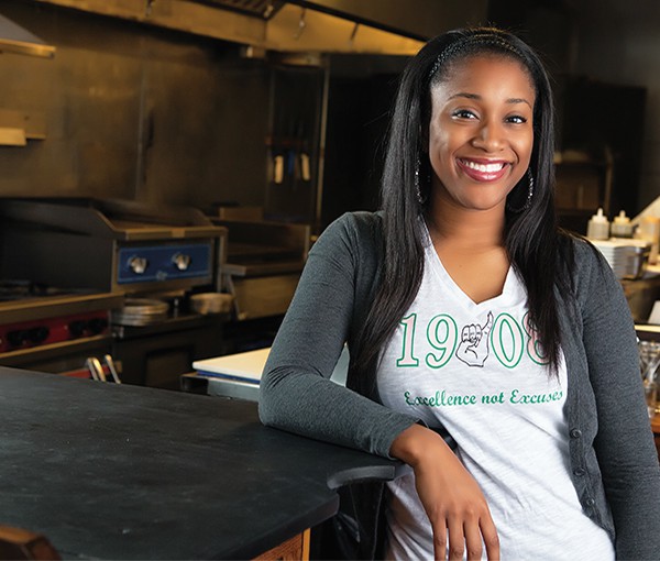 Deirdre R. Green, who earned her MS in Industrial Hygiene from the Department of Occupational and Environmental Health in 2014, poses in a restaurant. 