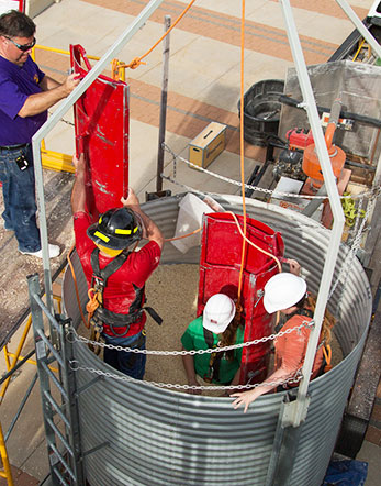 Students in the agricultural medicine course conduct a simulated grain bin rescue.