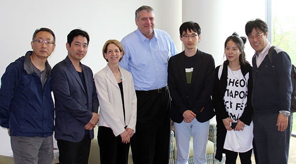 photo of Bill Field and Dean Sue Curry with South Korean visitors