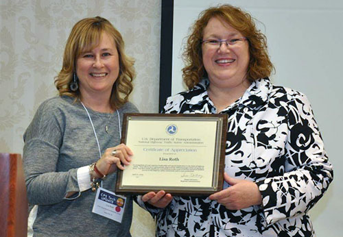 photo of Lisa Roth with award