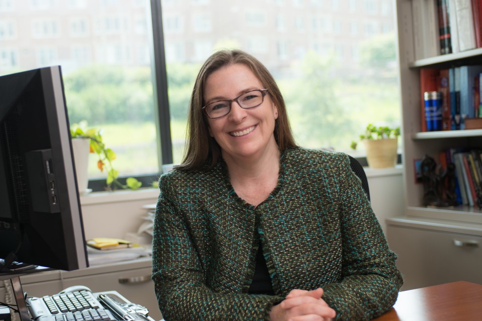 A portrait of Corinne Peek-Asa, Associate Dean for Research and Professor of Occupational and Environmental Health at the University of Iowa College of Public Health.