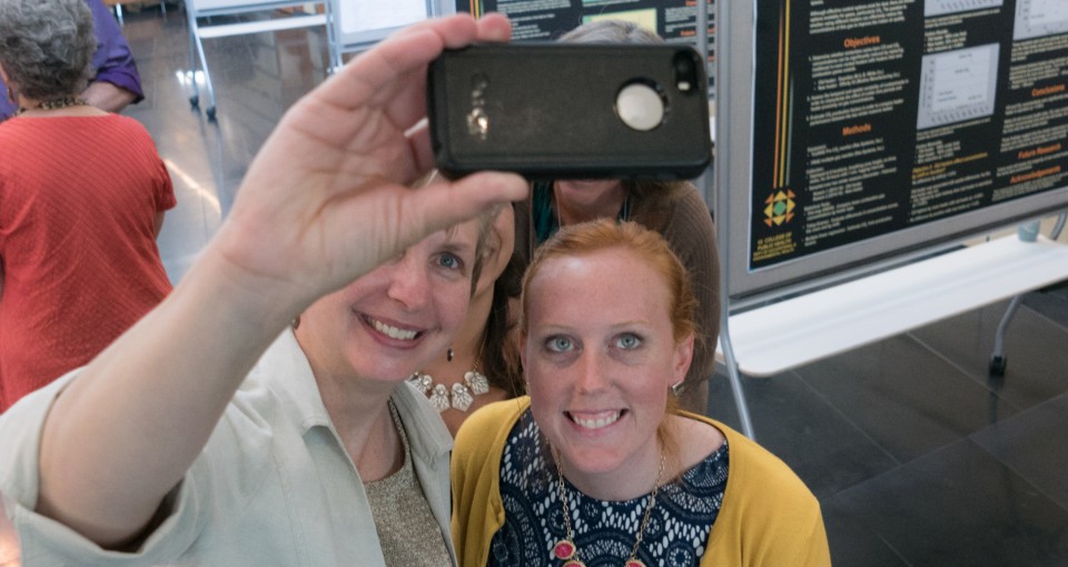 Prof. Diane Rohlman and PhD student Josie Rudolphi pose for a selfie at a recent poster session at the University of Iowa College of Public Health.