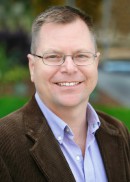 A portrait of Paul Gilbert, assistant professor of community and behavioral health at the University of Iowa College of Public Health.