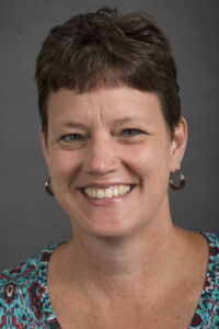 A portrait of Michele Hogue of the Department of Epidemiology Health in the College of Public Health at the University of Iowa.