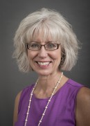 A portrait of Kim Merchant of the Department of Health Management and Policy in the College of Public Health at the University of Iowa.