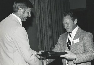 photo of Frank Lisella receiving award from William Foege