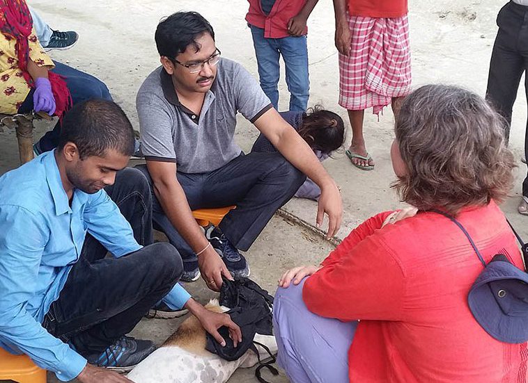 Dr. Christy Petersen speaking with men in India