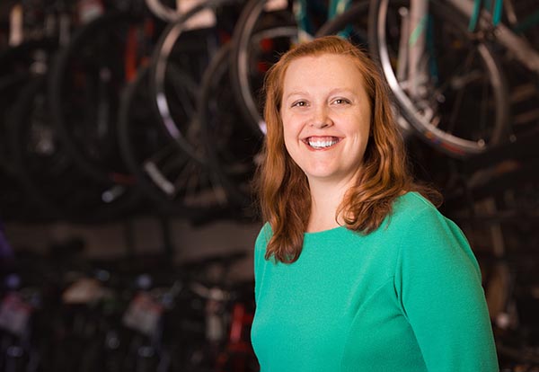 portrait of Cara Hamann at bicycle shop