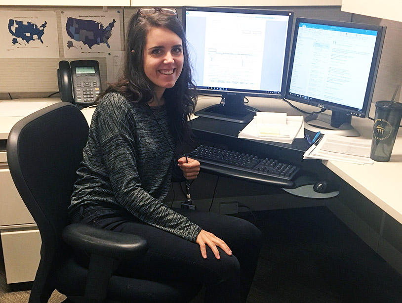 photo of Carolyne Bennett working at her desk at the CDC