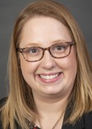 Portrait of Katie Christensen of the Department of Health Management and Policy at the University of Iowa College of Public Health.