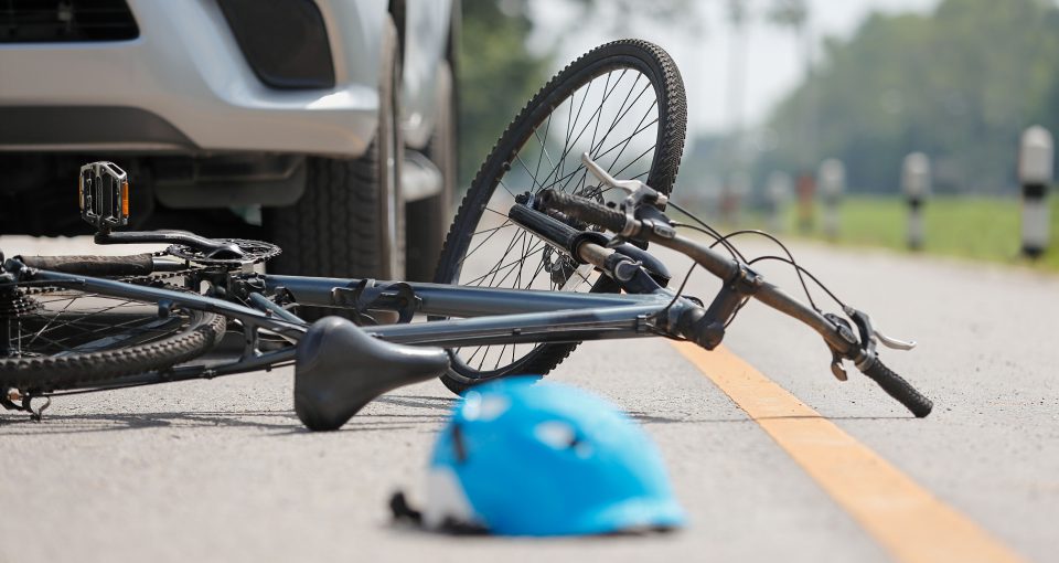 Accident car crash with bicycle on road