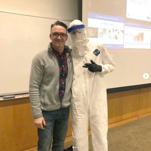 Matt Nonnenmann and a student demonstrate a hazmat suit