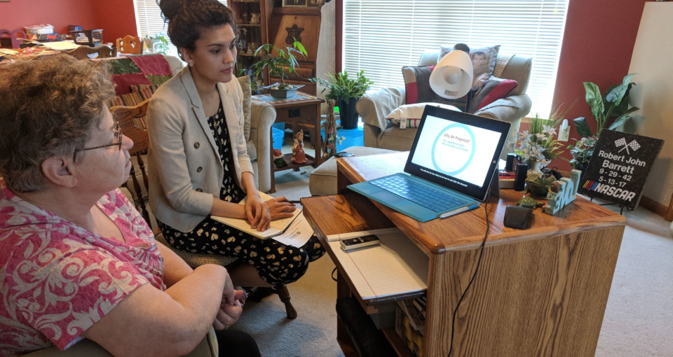 Worker training a patient in patient's home