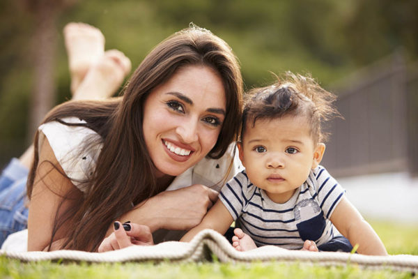 young mother smiling with her baby