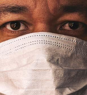 close up of a man wearing a face mask