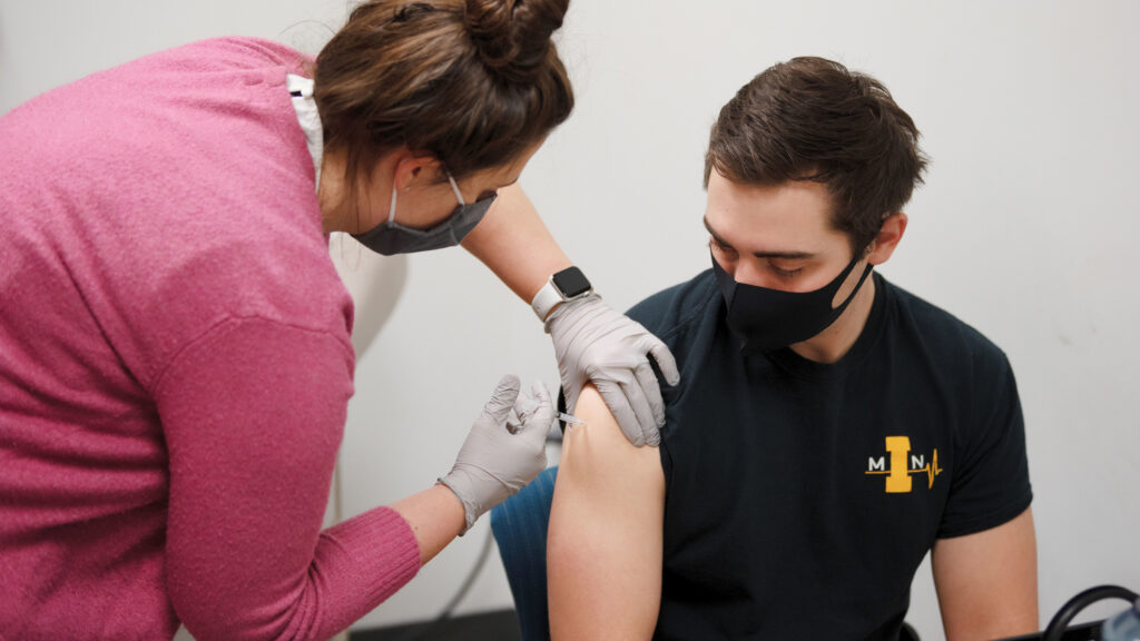 Jaelyn Pulkrabek, 4th year Pharmacy student administers the Moderna Covid-19 Vaccination at the Medical Education Research Facility (MERF) to College of Medicine and College of Nursing students