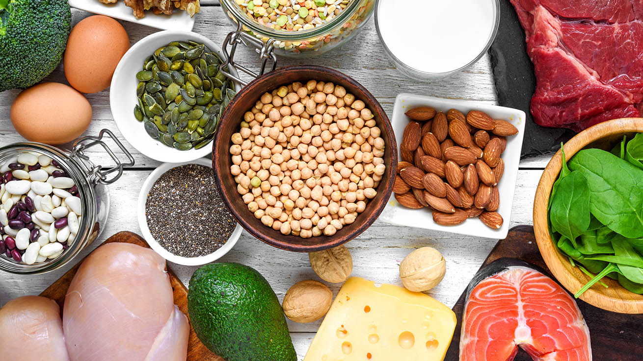 Selection of protein food sources. Meat, fish, vegetables, dairy, beans, nuts and seeds