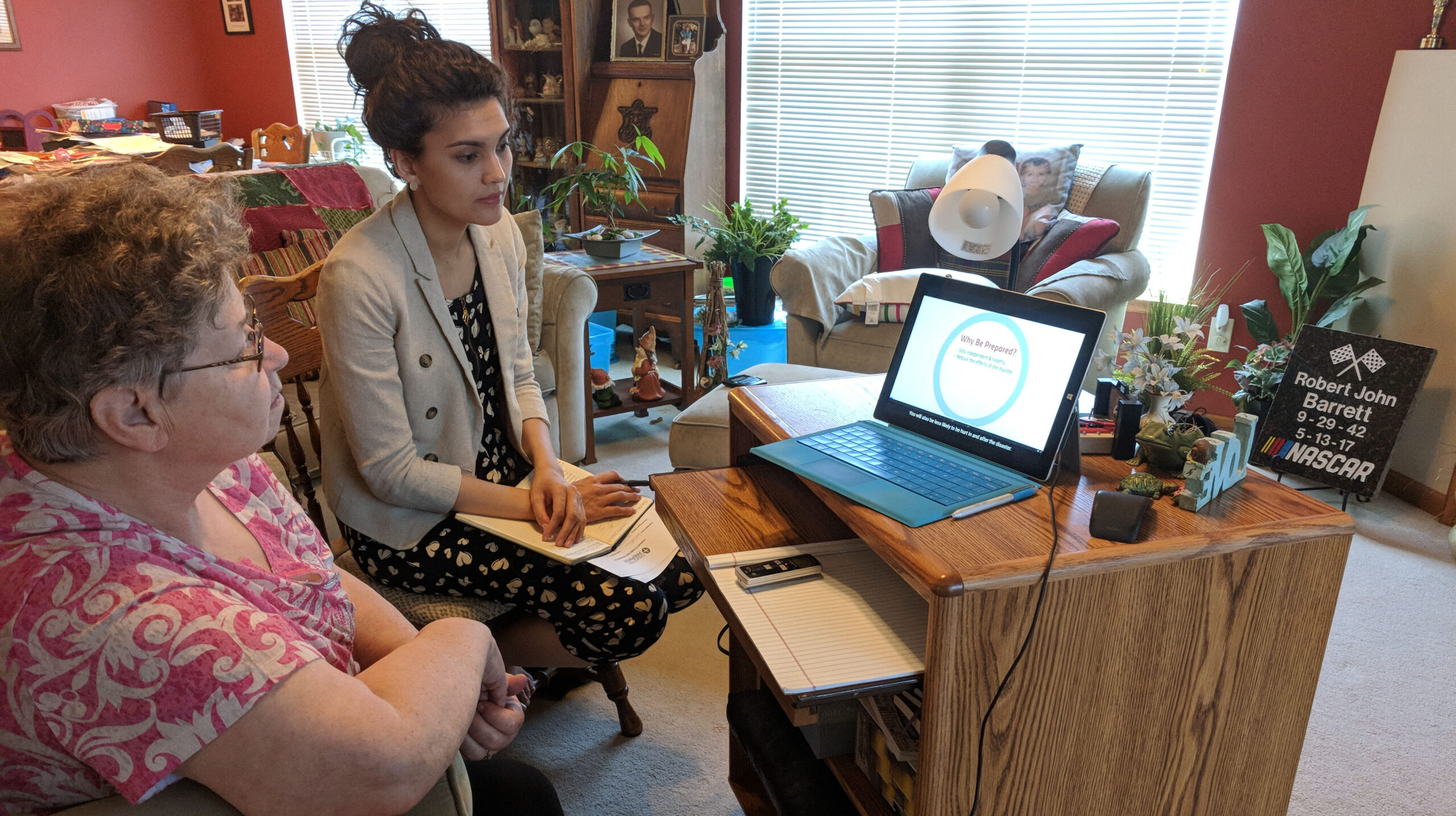 Worker training a patient in patient's home