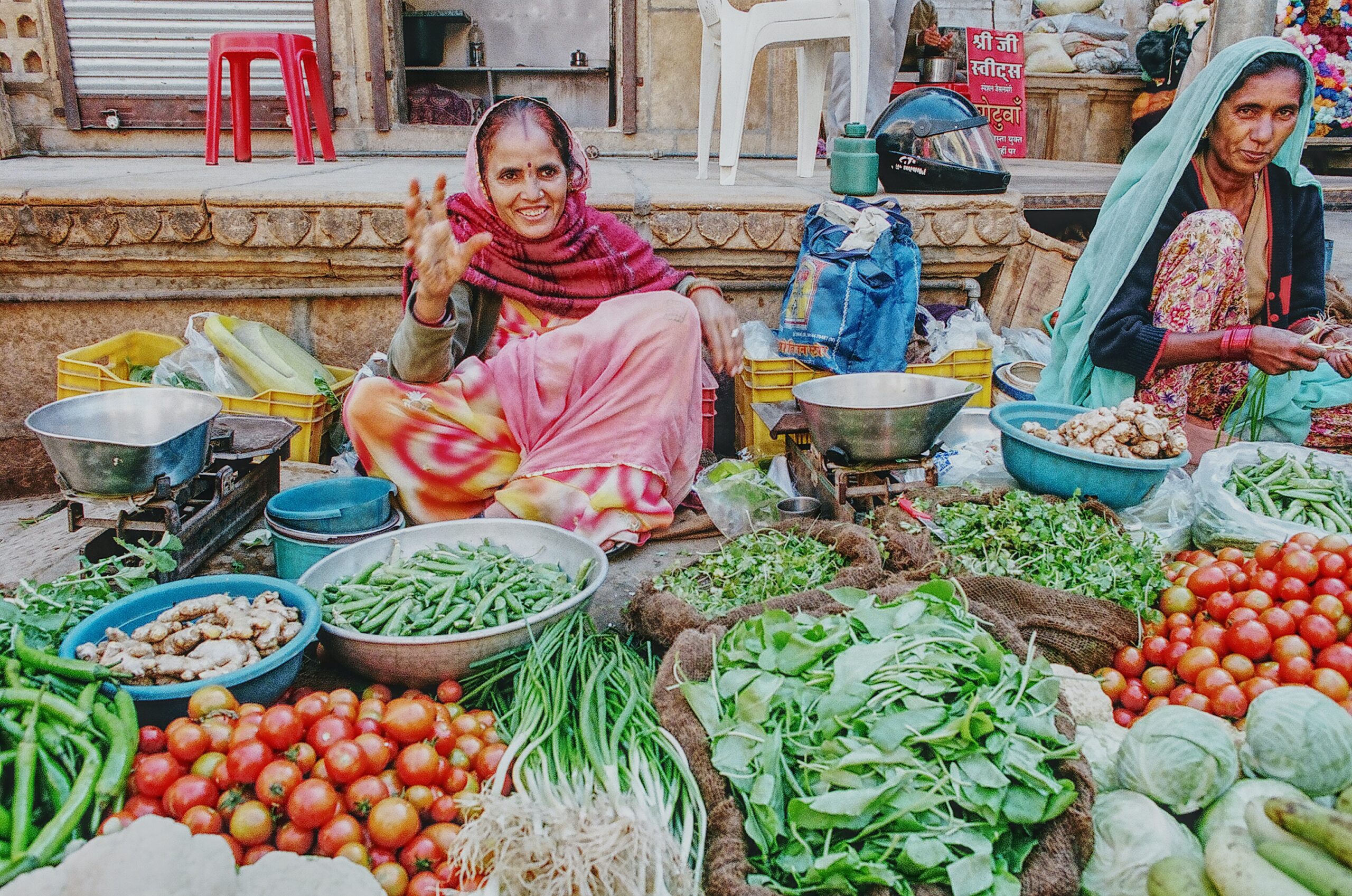 Indian women selling produce at open-air market