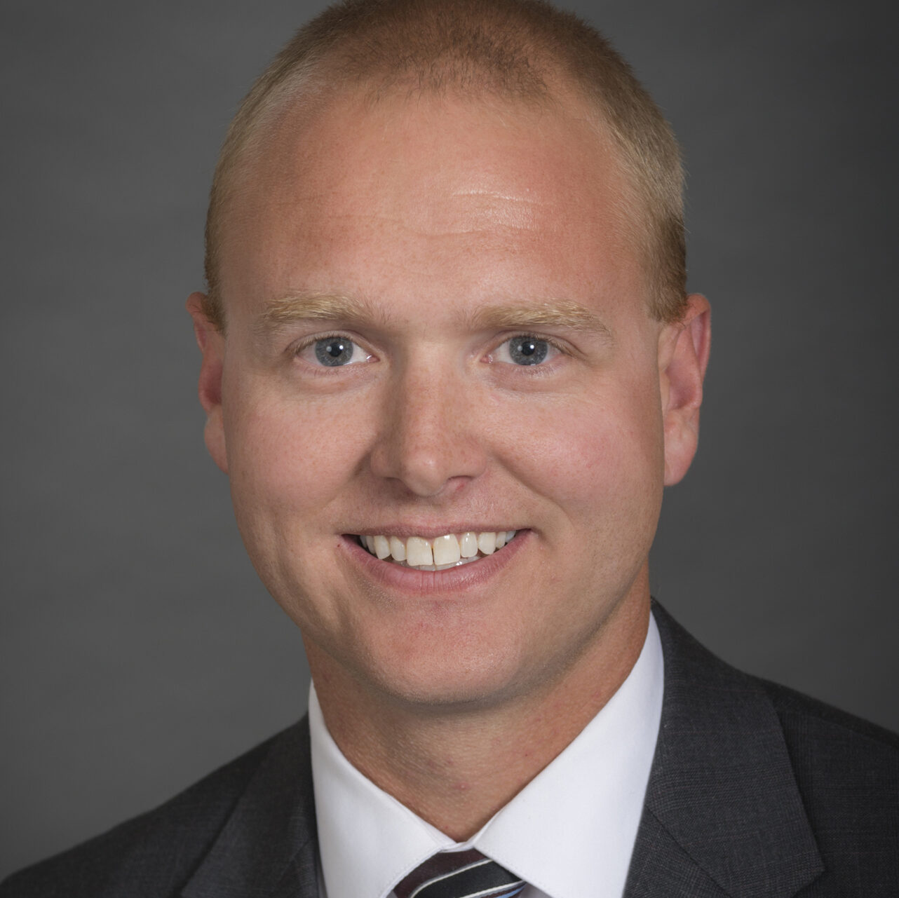 A portrait of Gregory Lehmann of the Department of Health Management and Policy in the College of Public Health at the University of Iowa.