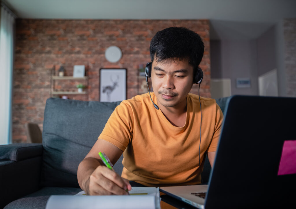 man working on computer from home