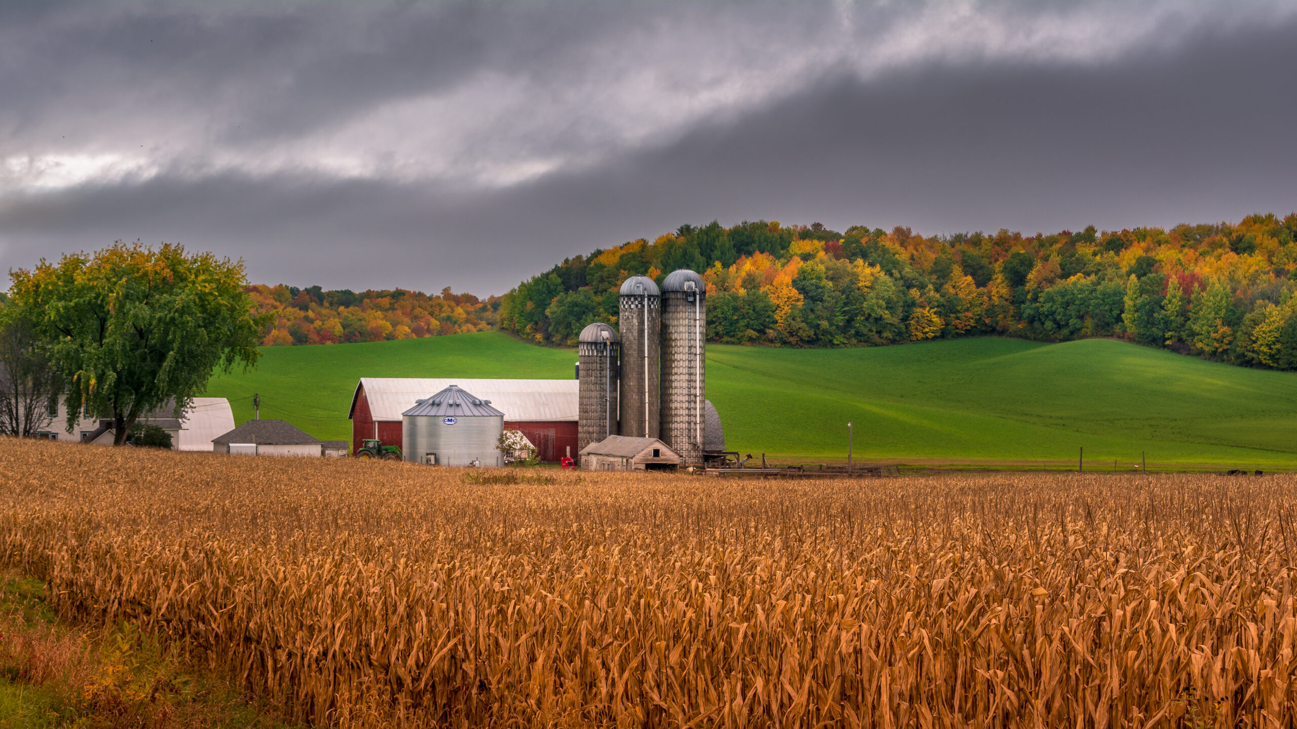 farm silo during fall with colorful trees