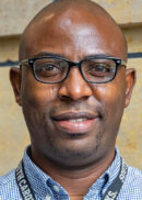 Portrait of Oluwafemi Adeagbo, professor in the Department of Community and Behavioral Health at the University of Iowa College of Public Health