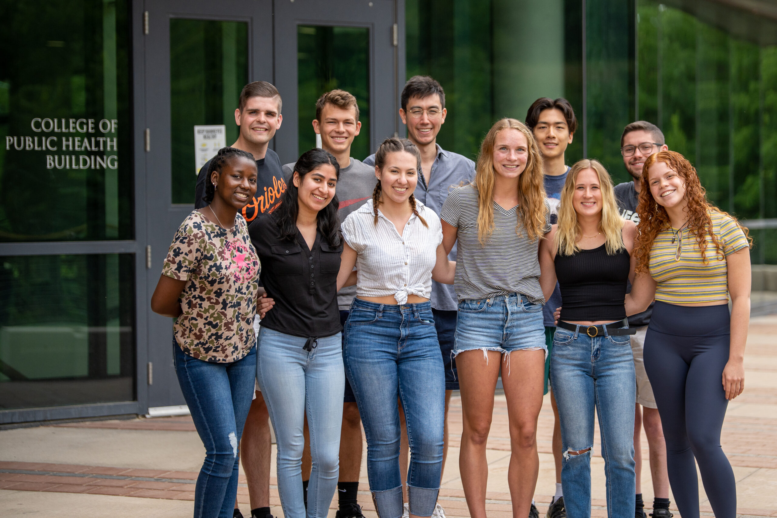 Portrait of the Iowa Summer Institute in Biostatistics class of 2022 posing in front of the College of Public Health Building.