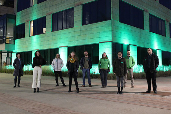 Members of the Injury Prevention Research Center pose outside of the CPH Building