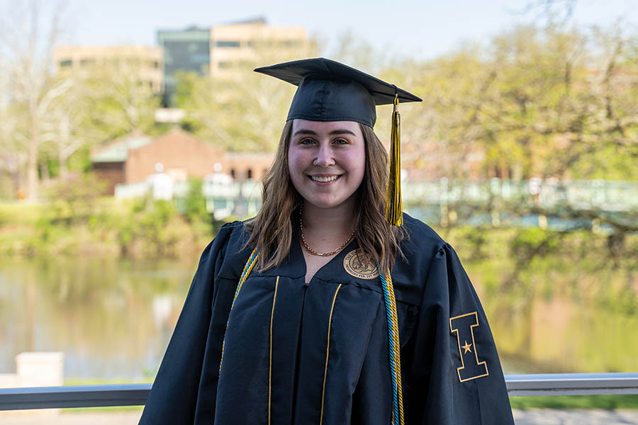 Morgan Jessie in graduation robes in May 2022