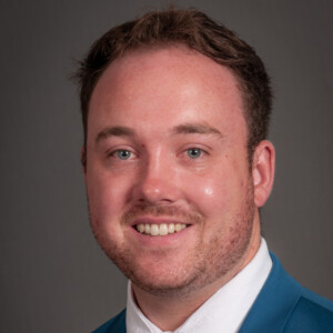 Portrait of Alex Marchant of the Department of Health Management and Policy at the University of Iowa College of Public Health.