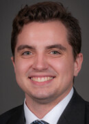 Portrait of Luke Harkness, of the Department of Health Management and Policy at the University of Iowa College of Public Health.