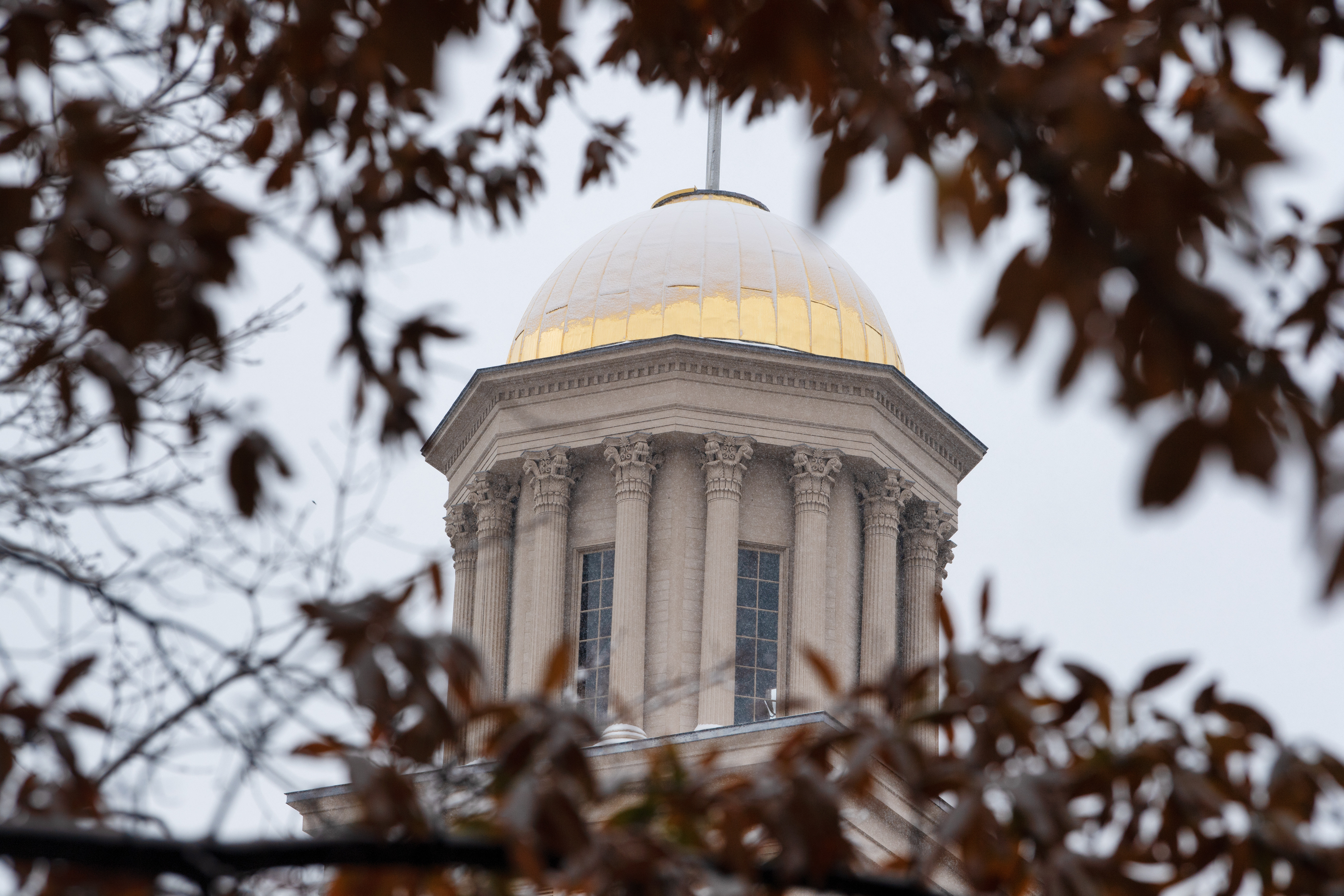 A dusting of snow covers the dome of the Old Capitol Building on the University of Iowa campus in November 2022.