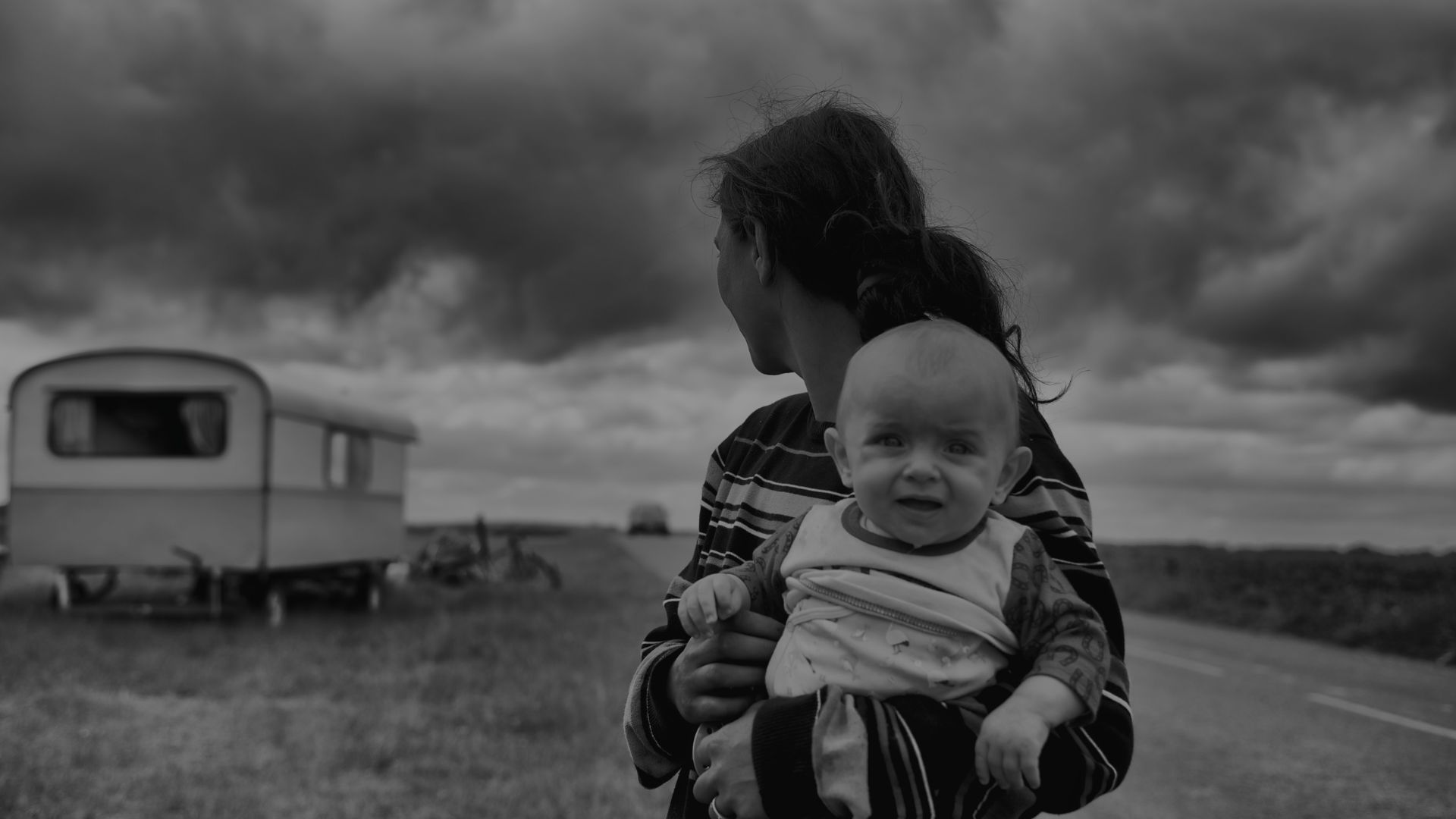 Mother holding upset baby