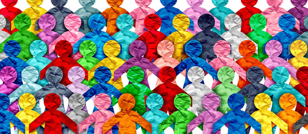 a variety of colors of paper cutouts of people to represent diversity 