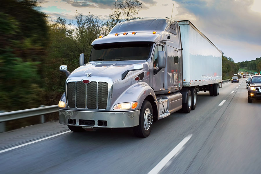 close-up of a semi truck on a busy interstate