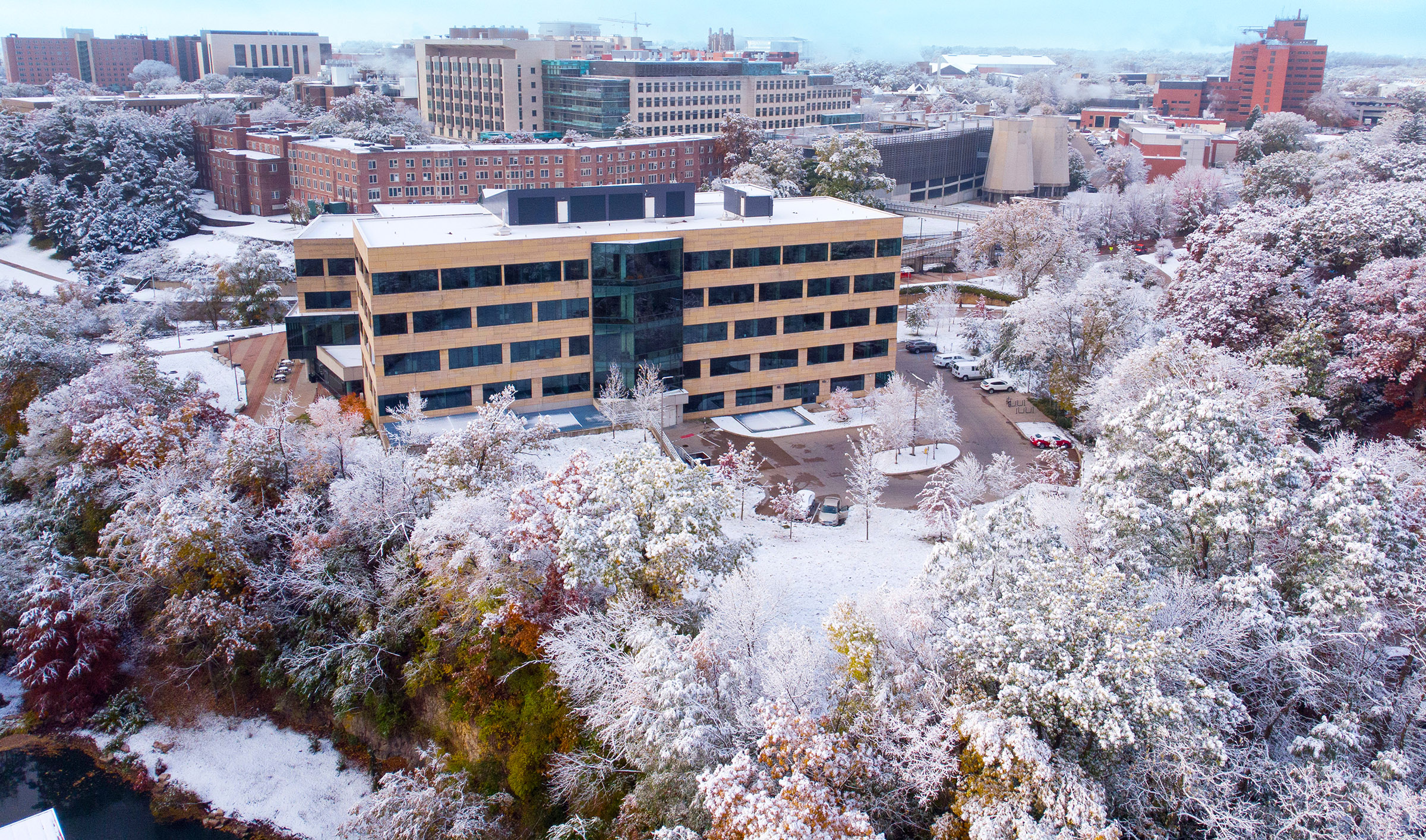 The University of Iowa College of Public Health Building (CPHB) seen from above with a covering of snow.