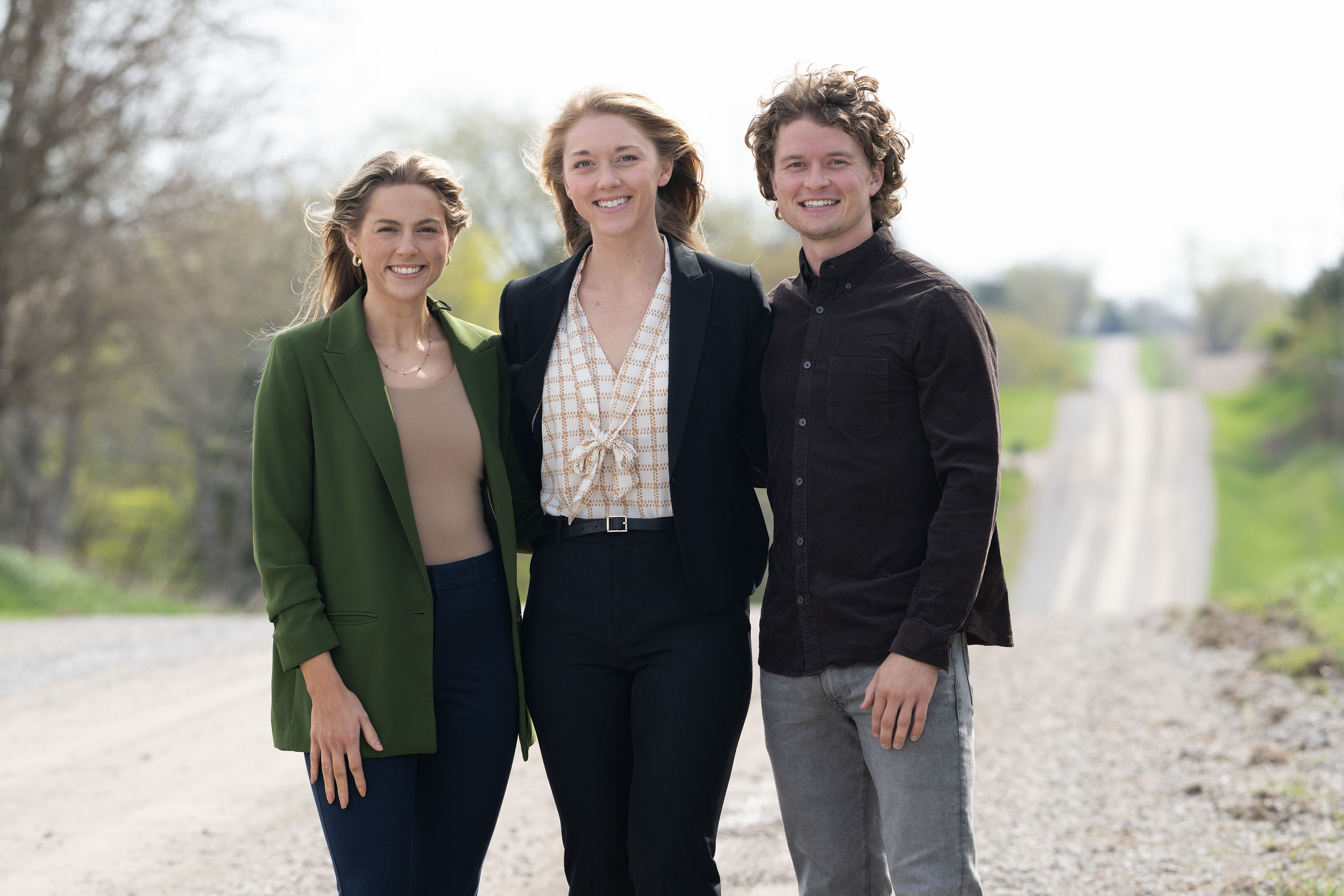 Jenah McCarty (green jacket), Hallie Vonk, and Nicholas Lembezeder are all graduating from the College of Public Health this spring. They helped found the Student Association for Rural Health.