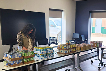 Public health worker with emergency food supplies