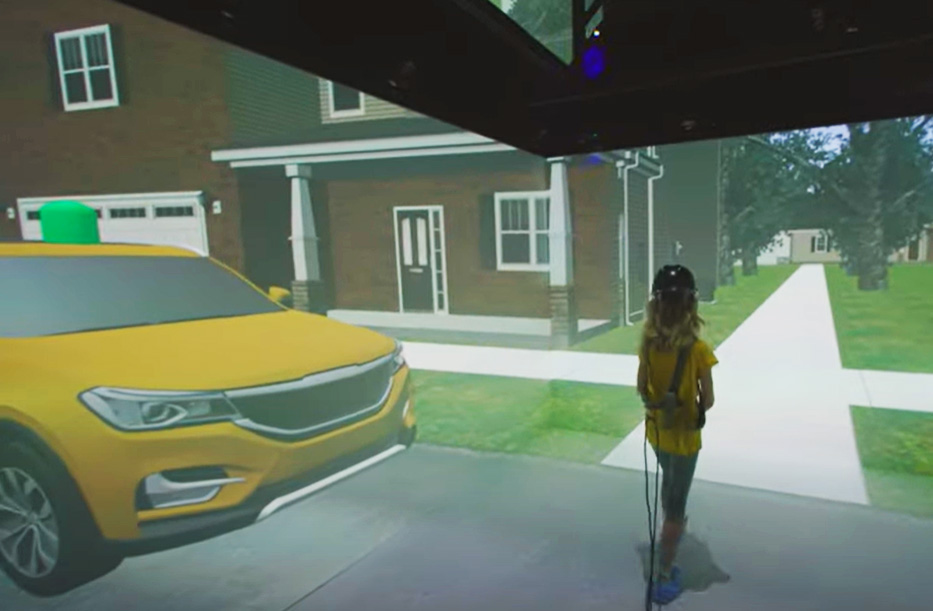 a girl walking in a virtual environment simulating a crosswalk and stopped car