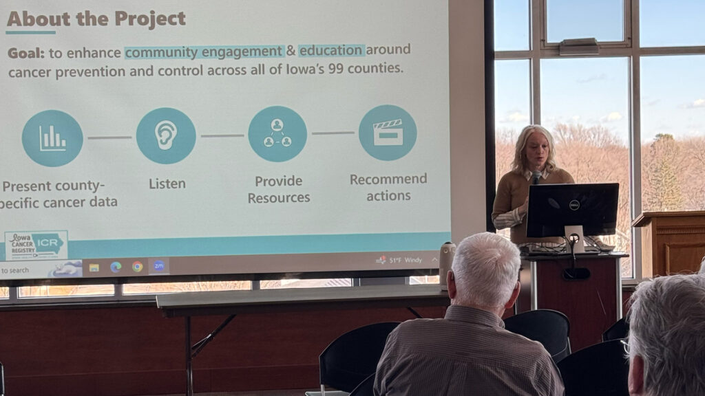 Mary Charlton presenting cancer data