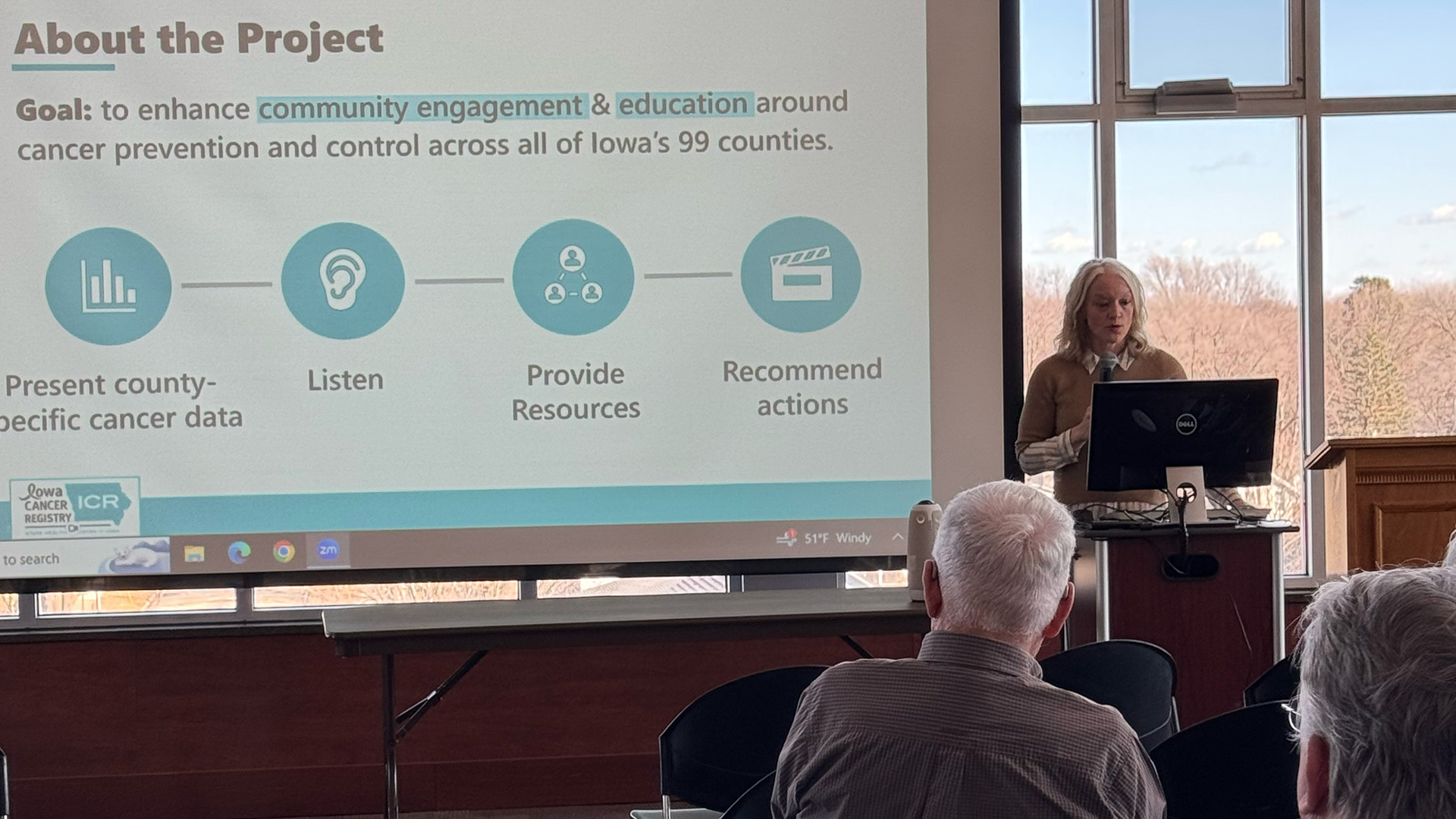 Mary Charlton presenting cancer data